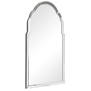 Uttermost Brayden frameless arched wall mirror with pearl silver finish, showcasing a sleek, curved design hanging on a wall.