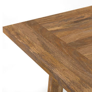 Simpli-Home Whitley dining table with a wooden surface and sturdy legs, ideal for modern dining rooms.