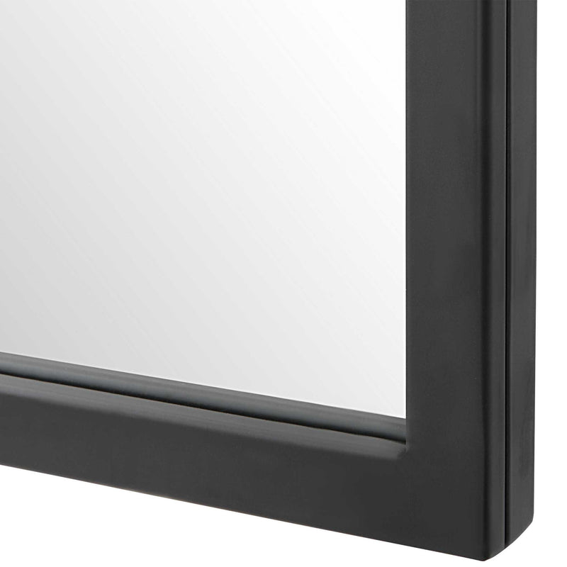 Uttermost Kenitra arch mirror with a sleek, curved frame reflecting light and adding elegance to modern interior decor.