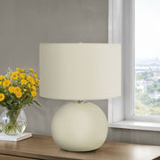 Contemporary cream ceramic table lamp by 8th Street with a sleek, modern design and smooth finish.