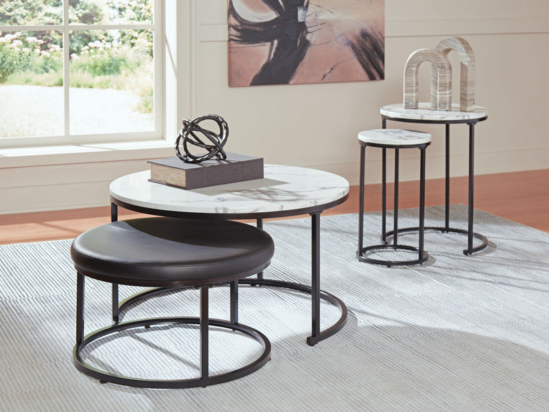 Set of four black and white Signature Design by Ashley nesting tables, stylish and versatile living room furniture.