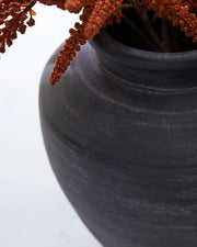 Signature Design by Ashley 12-inch vase from the Meadie collection, featuring a sleek ceramic design suitable for home décor.