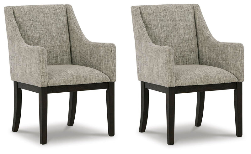 Set of two beige and dark brown Signature Design by Ashley dining UPH arm chairs with upholstered seats and wooden legs.