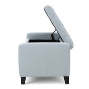 Noble House Guernsey storage ottoman with tufted top, upholstered in neutral fabric, serving as a stylish, versatile storage solution.