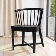 Set of two Americana Modern Parker House black barrel dining chairs with sleek, curved design for contemporary dining rooms.