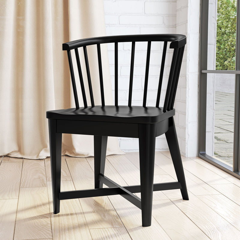 Set of two Americana Modern Parker House black barrel dining chairs with sleek, curved design for contemporary dining rooms.
