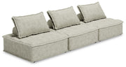 Signature Design by Ashley stationary sectional sofa with plush cushions and neutral upholstery in a modern living room setting