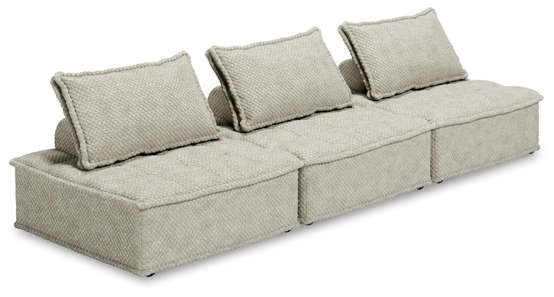 Signature Design by Ashley stationary sectional sofa with plush cushions and neutral upholstery in a modern living room setting