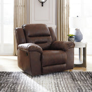 Signature Design by Ashley® Stoneland rocker recliner with plush upholstery and wooden base, showcasing its comfortable and stylish design.