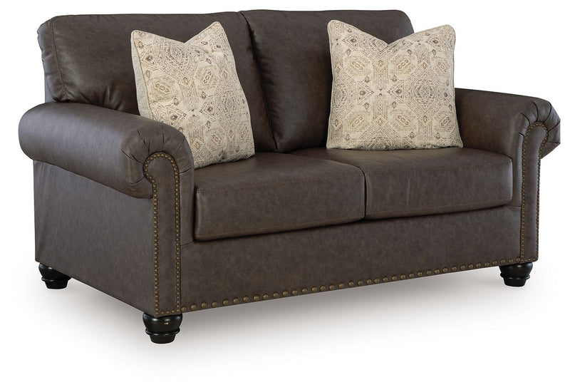Benchcraft Roxmere living room set with stationary chair and matching ottoman, featuring plush upholstery and stylish design.