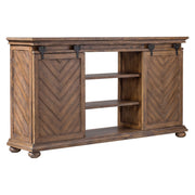 Uttermost Primalia barn door media console in light brown wood finish, featuring sliding barn door design and open shelving for TV and media storage.