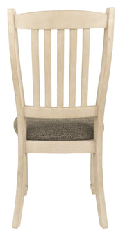 Set of two Bolanburg dining UPH side chairs with rake back in brown and beige fabric, designed for comfortable kitchen or dining room seating.