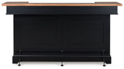 Wildenauer brown and black bar table by Signature Design Ashley, featuring a sleek modern design with a sturdy wooden top.