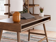 Signature Design by Ashley Lyncott home office desk with a spacious wooden surface and sleek modern design.