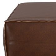 Simpli-Home Brody large square coffee table pouf used as an accent piece with a modern fabric cover and sturdy construction.