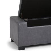 Large Simpli-Home Laredo storage ottoman with a contemporary design and fabric upholstery, serving as a versatile storage and seating piece.
