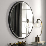 Black round wall mirror by Uttermost with a sleek, modern frame, ideal for contemporary home decor.