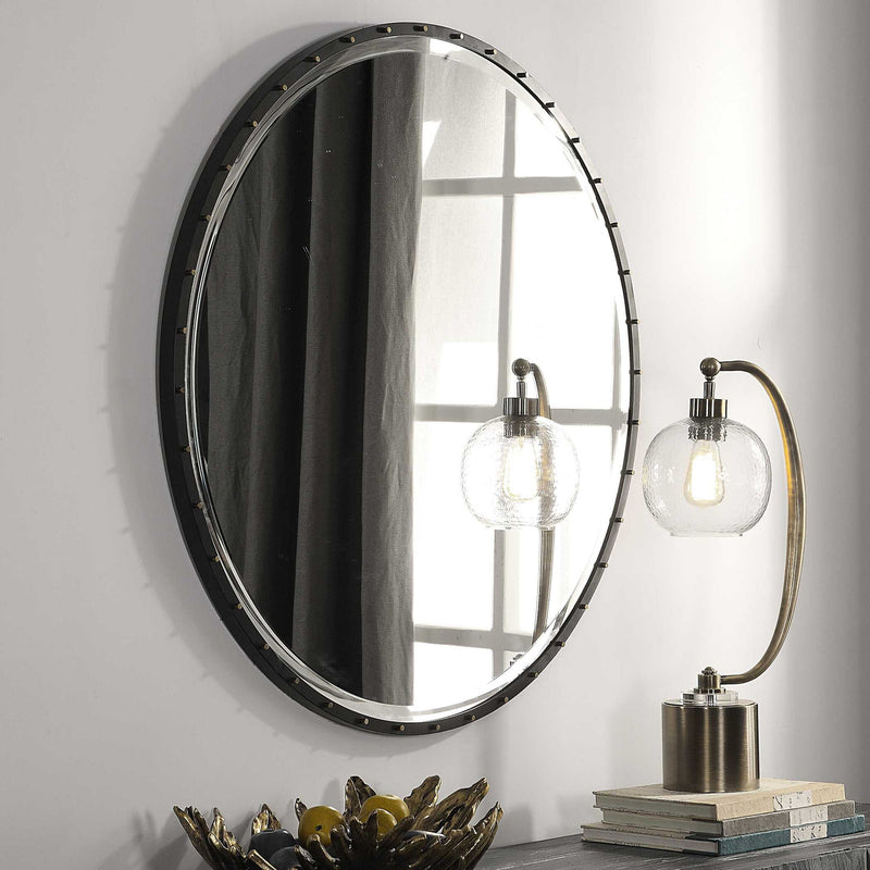Black round wall mirror by Uttermost with a sleek, modern frame, ideal for contemporary home decor.