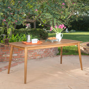 Outdoor dining table with teak top and metal frame by Noble House, perfect for patio or garden dining.
