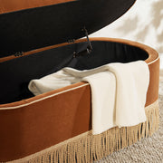 Jennifer Taylor Home Melinda oval tufted bullion fringe storage bench with beige upholstery and decorative nailhead trim.