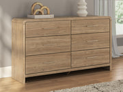 Signature Design by Ashley six-drawer dresser in warm wood finish with sleek modern handles and spacious storage drawers.
