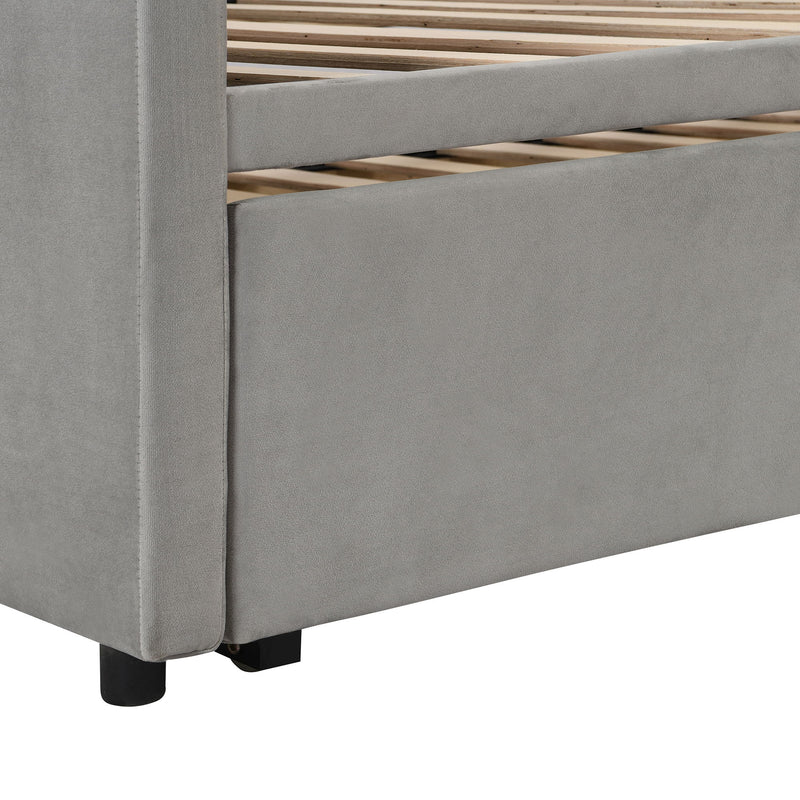 Twin size upholstered daybed with pop-up trundle from Halcyon Home, featuring a cushioned headboard and clean modern design.