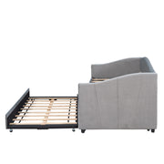DreamHaus upholstered daybed sofa bed with trundle and wood slat base, showing plush fabric, wooden frame, and built-in trundle bed.