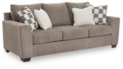 Benchcraft stationary sofa with plush upholstery, featuring a modern design and comfortable seating for living room decor.