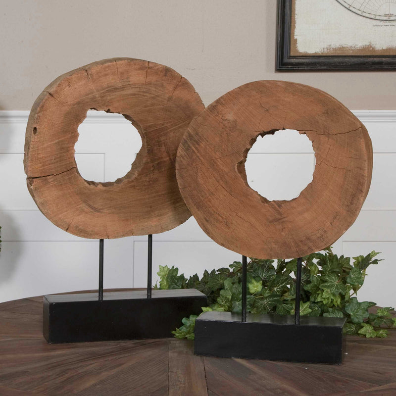 Uttermost Ashlea wooden sculptures set of 2 in light brown and black, featuring modern abstract figurine designs.