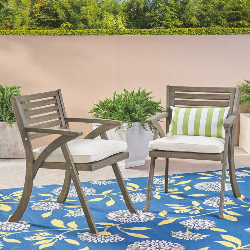 Set of two Noble House Helen outdoor acacia wood dining chairs in gray and creme, showcasing sleek design and sturdy construction.