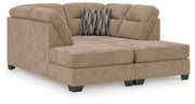 Benchcraft Olten stationary sectional sofa with plush cushions and fabric upholstery in a modern living room setting.