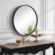 Uttermost Belham round black iron wall mirror with sleek metal frame, modern decorative wall mirror for stylish home decor.