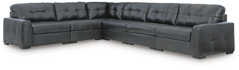 Signature Design by Ashley Brindley Pier stationary sectional sofa with plush cushions and modern design in a living room setting.