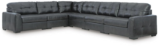 Signature Design by Ashley Brindley Pier stationary sectional sofa with plush cushions and modern design in a living room setting.