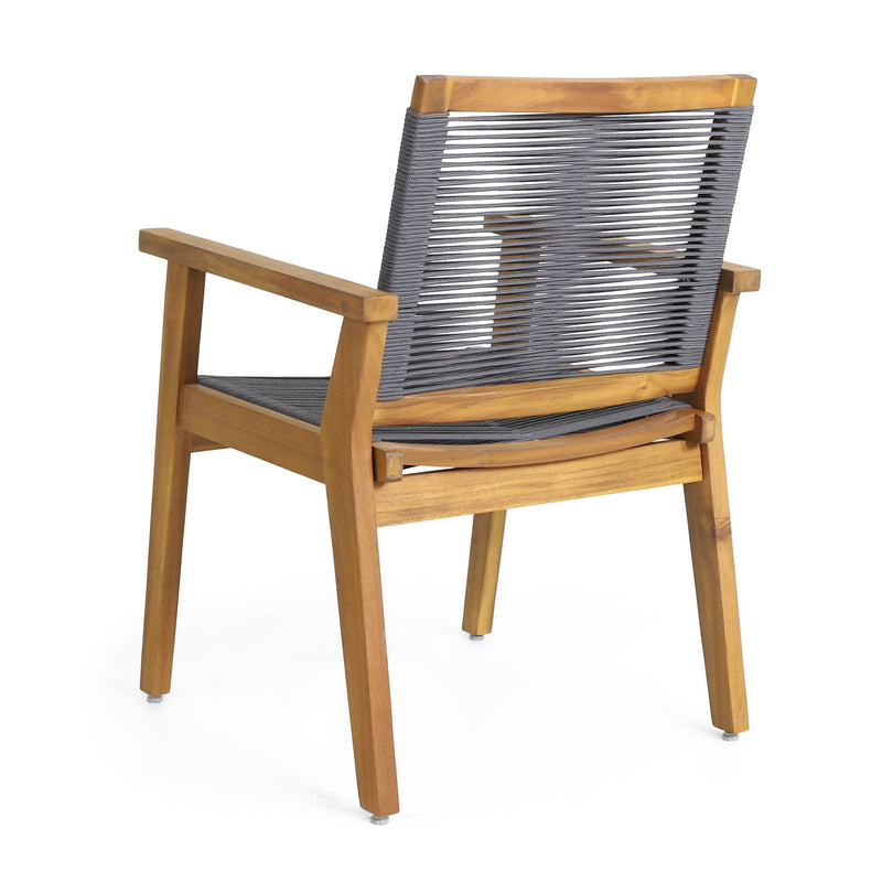 Two Noble House outdoor rope dining chairs with metal frames and woven rope seats, set against a garden background.