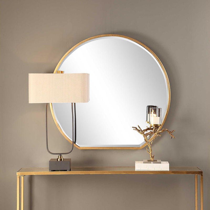 Uttermost Cabell wall mirror with a sleek, modern frame, hanging on a wall, showcasing stylish home decor.