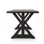 Modern Noble House outdoor dining table with X-shaped legs and umbrella hole, suitable for patio or garden dining areas.