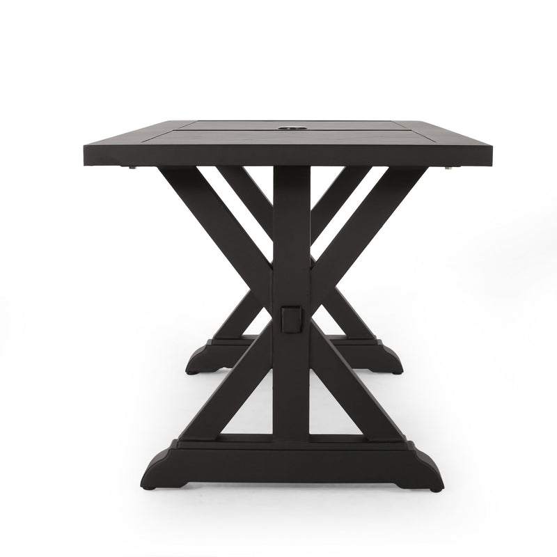 Modern Noble House outdoor dining table with X-shaped legs and umbrella hole, suitable for patio or garden dining areas.