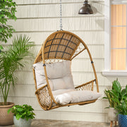 Noble House Malia wicker hanging chair with cushion, featuring a cozy seat and wooden frame for outdoor relaxation.
