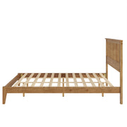Ridgecrest Home Malinda panel bed with a wooden frame and headboard, shown in a cozy bedroom setting.