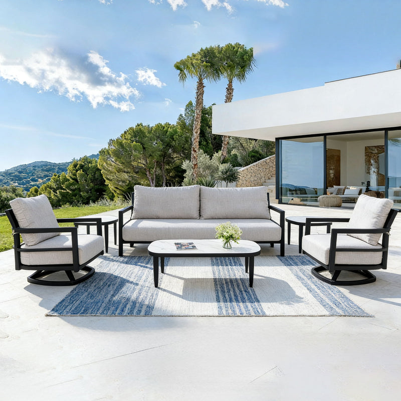 Life Outside 4-piece outdoor conversation set with chairs, bench sofa, tables, and Sunbrella cushions in a cozy patio setting.