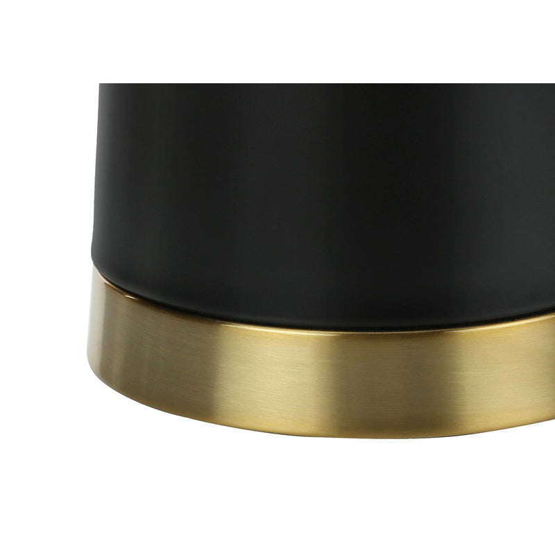 Contemporary black and cream resin table lamp with sleek design, perfect for modern living spaces.