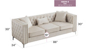 Glory Furniture Paige stationary sofa in a modern living room with plush fabric upholstery and decorative cushions.