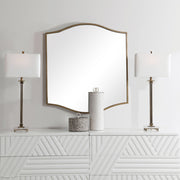 Gold Cerise wall mirror by Uttermost featuring a round mirror with a stylish gold frame.