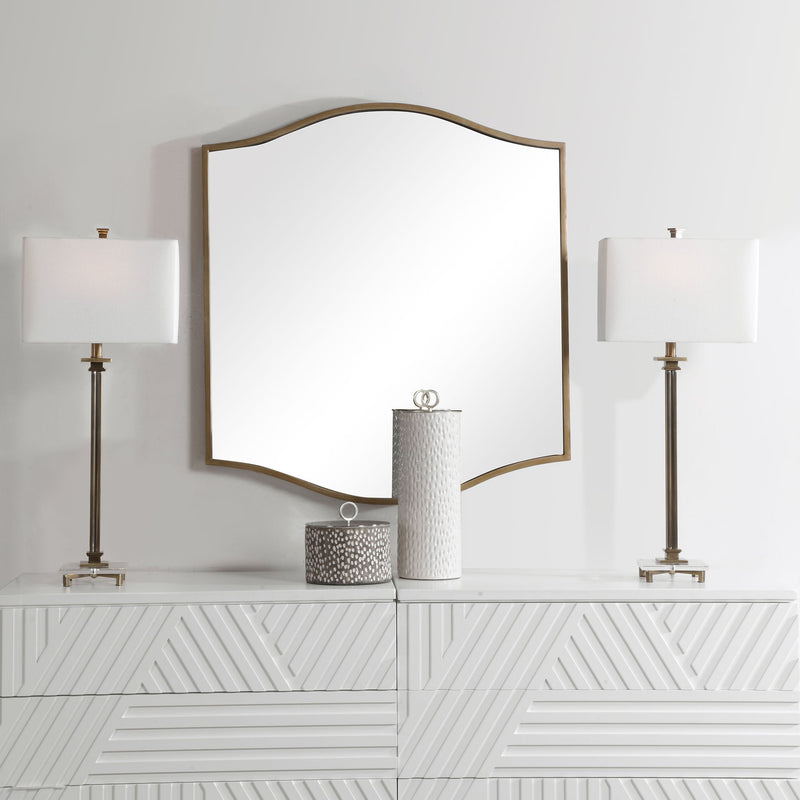 Gold Cerise wall mirror by Uttermost featuring a round mirror with a stylish gold frame.