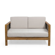 Outdoor 4 seater acacia wood chat set with wicker accents and beige cushions, perfect for patio relaxation.
