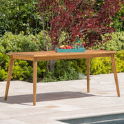 Outdoor dining table with teak frame by Noble House, showing a sturdy rectangular design suitable for outdoor meals