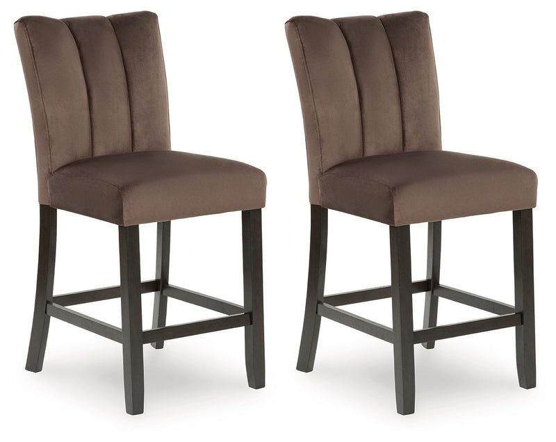 Pair of Jeshina upholstered barstools in mocha by Signature Design, featuring cushioned seats and wooden legs for stylish seating.