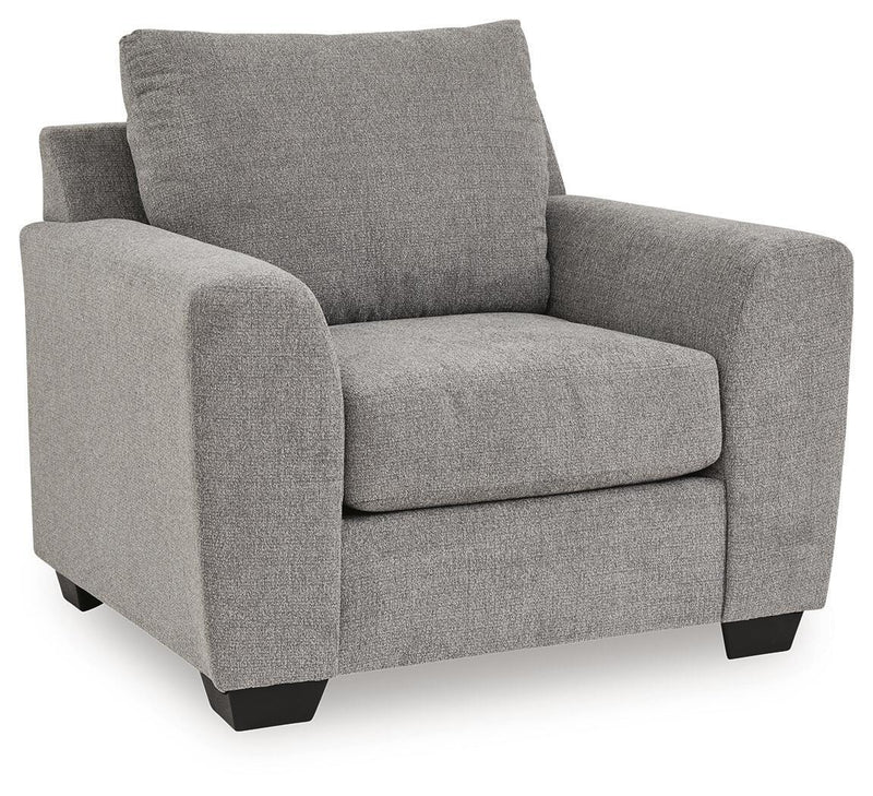 Benchcraft® Loreo arm chair with plush fabric upholstery and cushioned backrest, perfect for living room seating.