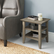 Handcrafted Acadian end table by Simpli-Home with a rustic wood finish and sturdy square legs, ideal for living room or bedroom.